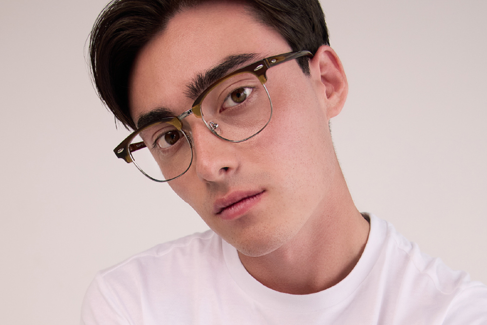 Marco eyeglasses frame worn by model.